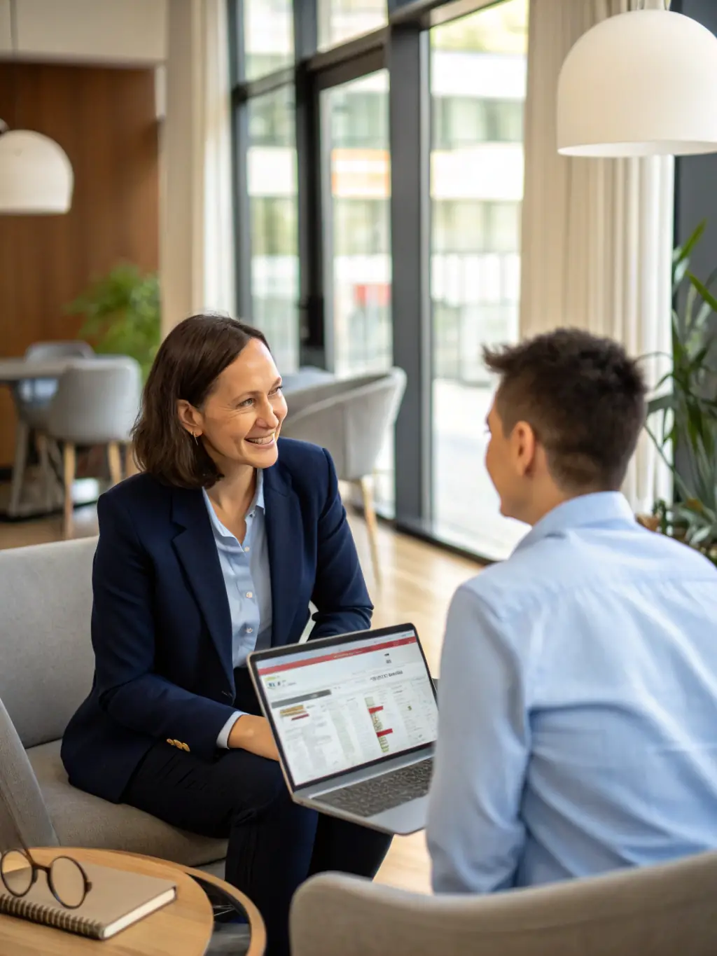 A photo of a project manager reviewing server specifications with a client in a modern office setting, emphasizing collaboration and attention to detail.